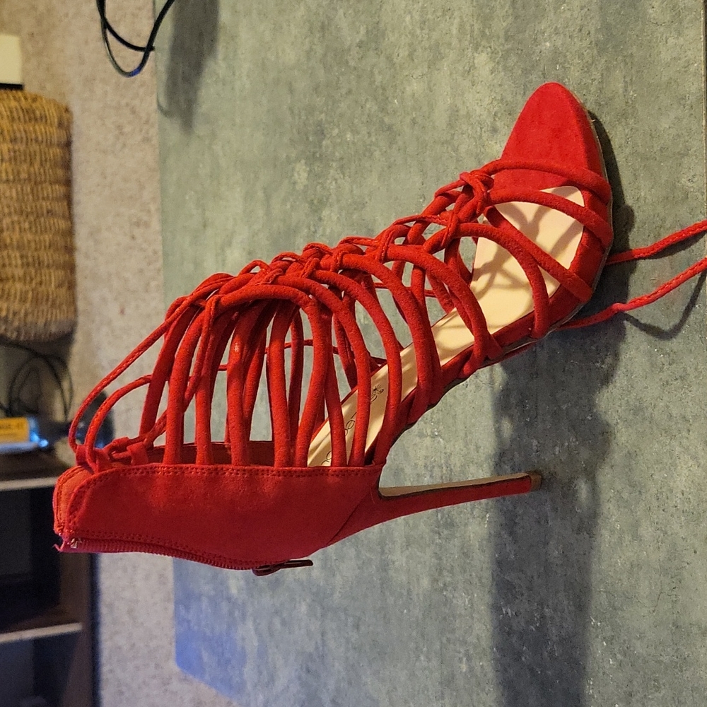 Red suede strappy heels with tassles